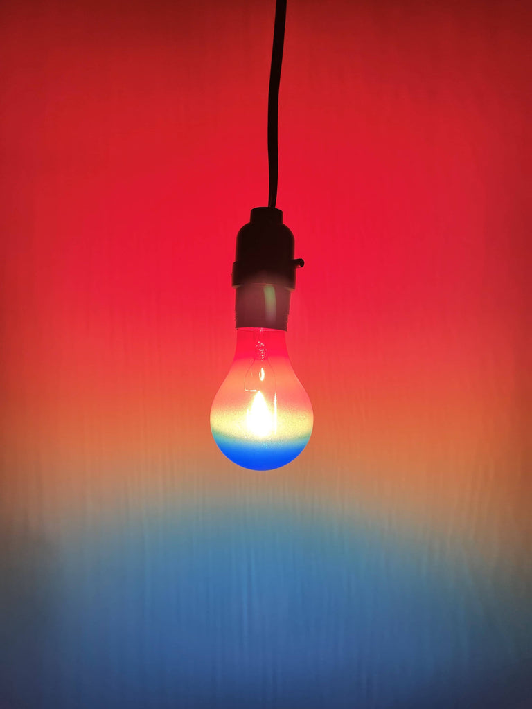 A blue, yellow, and red light bulb