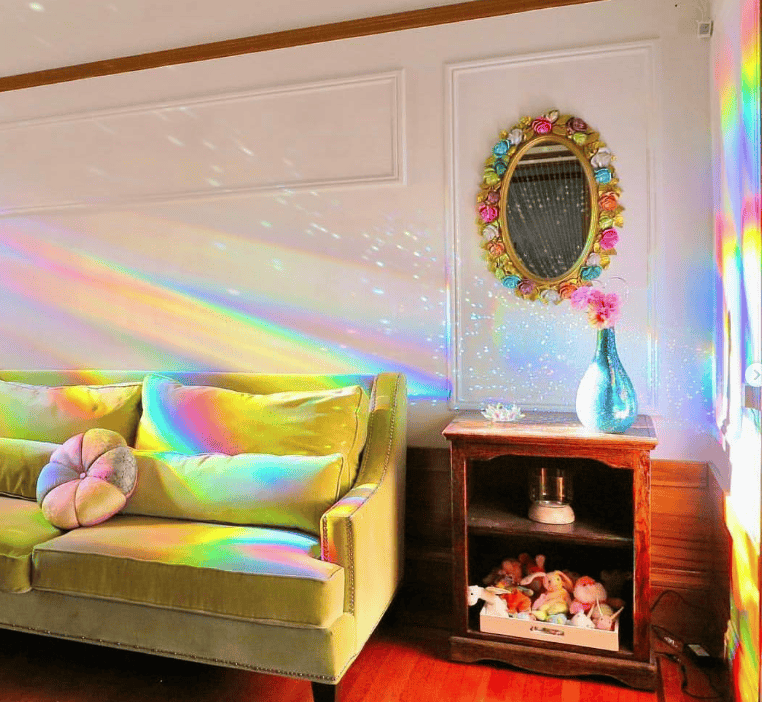 A room covered in rainbows made by Rainbow Symphony Holographic Suncatcher Rainbow Window Film