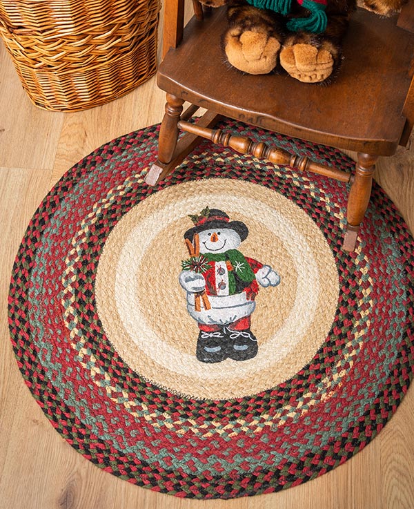 Accent rug with snowman in top hat design under rocking chair