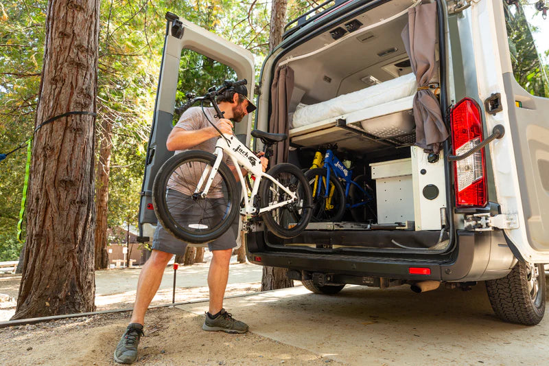 Guy loading a JackRabbit OG2 into the back of his RV van.