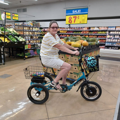 Woman on a liberty trike in a store
