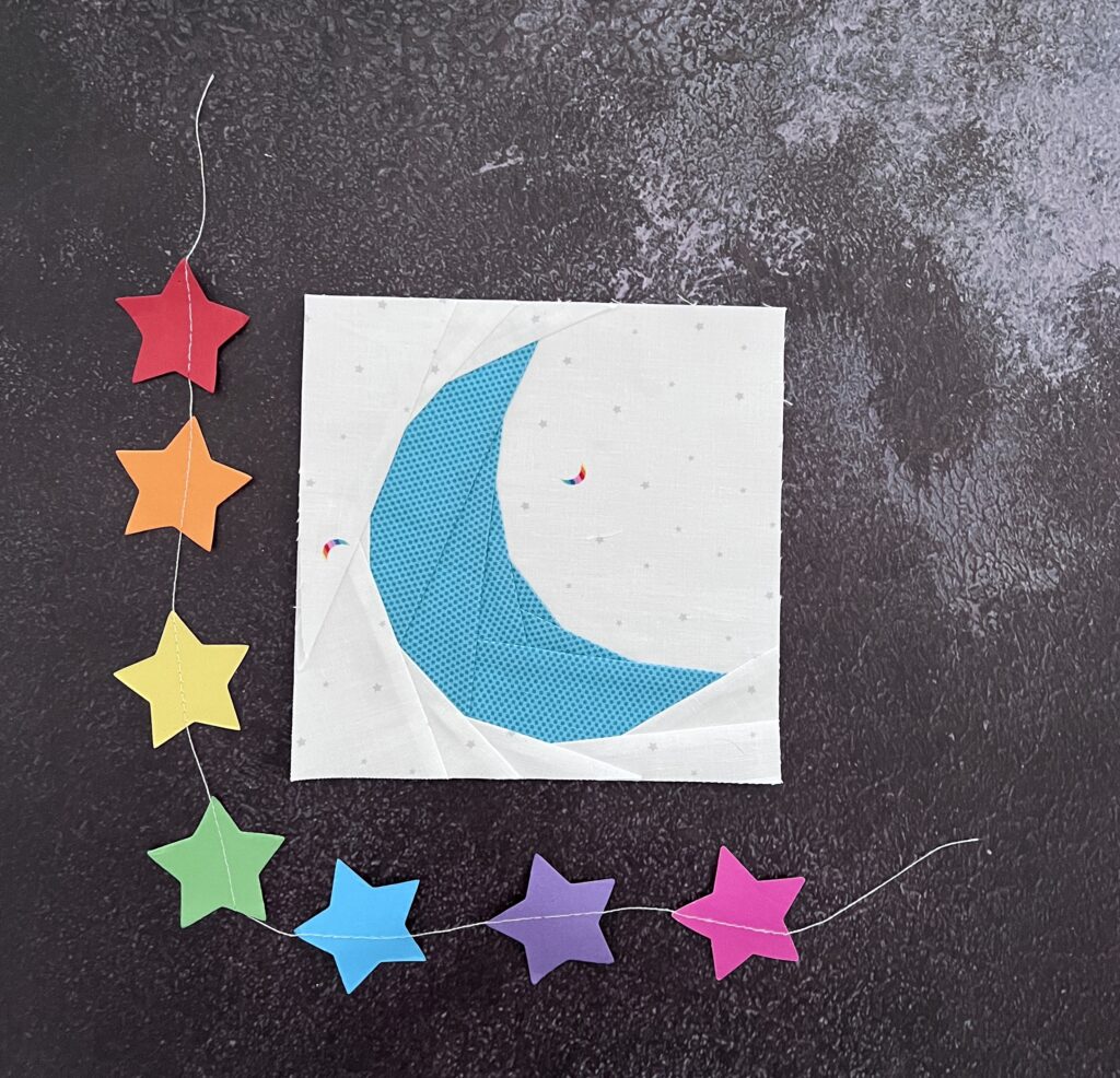 Foundation paper pieced moon pattern featuring Hush Hush vol 3 as the background print