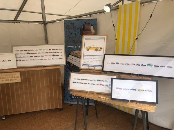 Goodwood Festival of Speed tented unit showing bespoke car artwork framed and stand furniture 