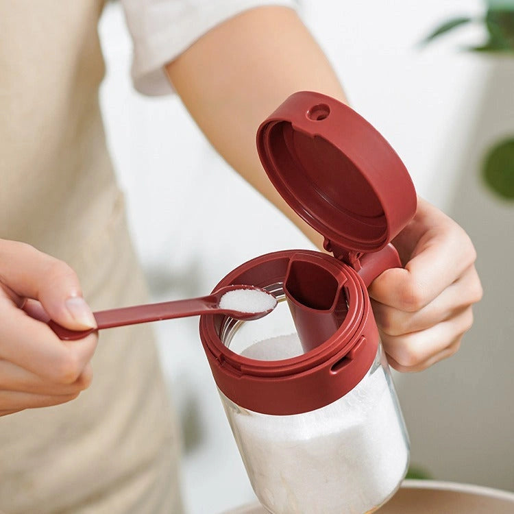 Small seasoning jars with lids and spoons for precise measuring and storage