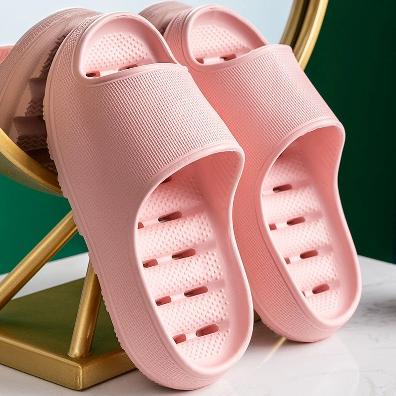Thick-soled EVA slippers with water leakage design for home and bathroom use