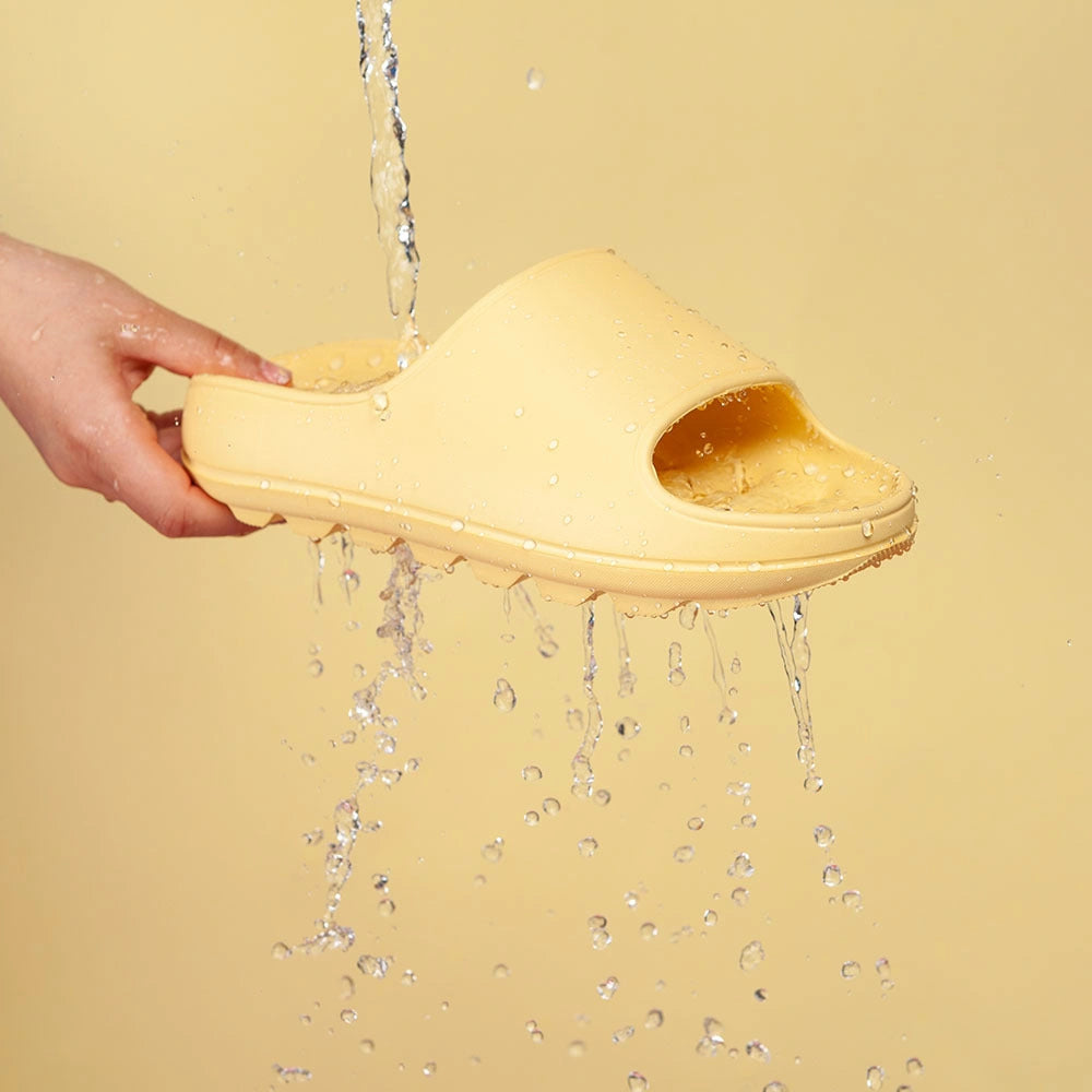 Thick-soled EVA slippers with water leakage design for home and bathroom use