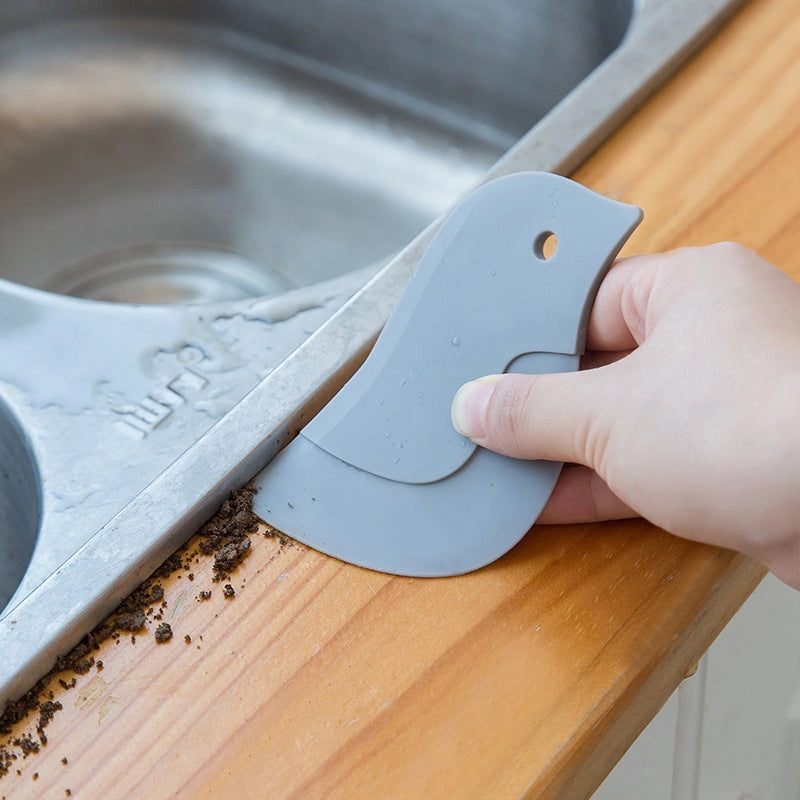 Penguin-shaped soft blade scraper for efficient kitchen cleaning