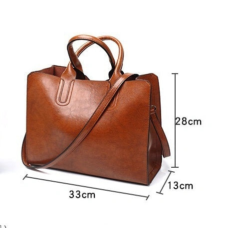 Sofia Spanish Trunk Tote with zipper opening and multiple compartments