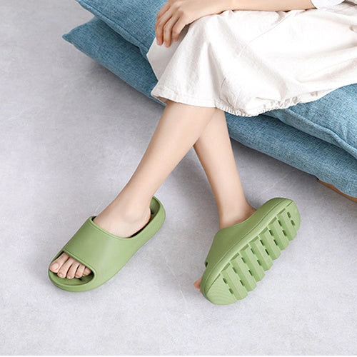 Thick-soled EVA slippers with water leakage design for home and bathroom use