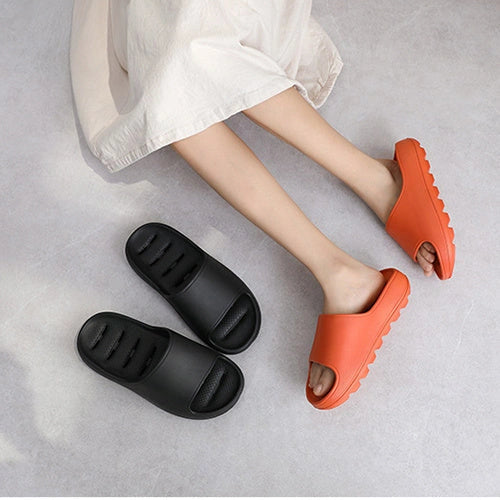 Thick-soled EVA slippers with water leakage design for home and bathroom use