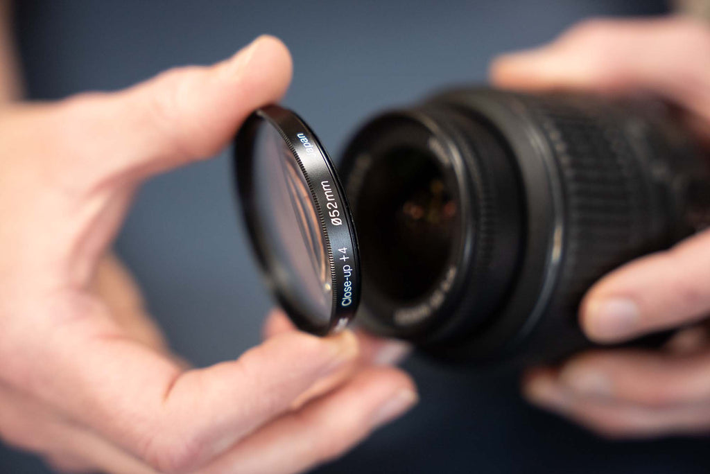 Attaching a +4 close up lens for use behind a dome port underwater © Ikelite