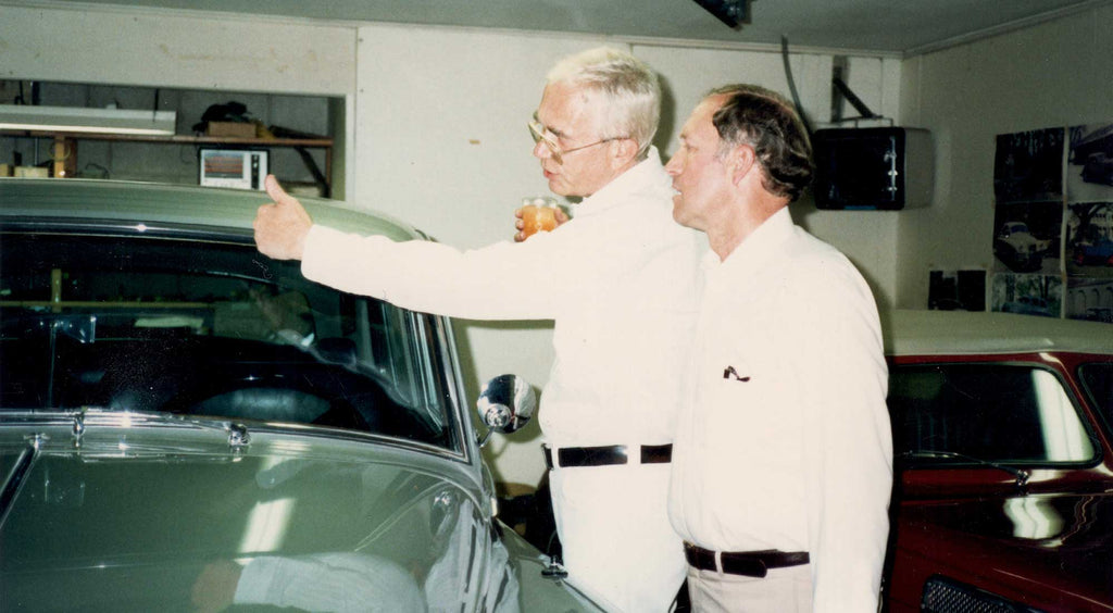 Ike Brigham and Gene Perkins discussing car collection