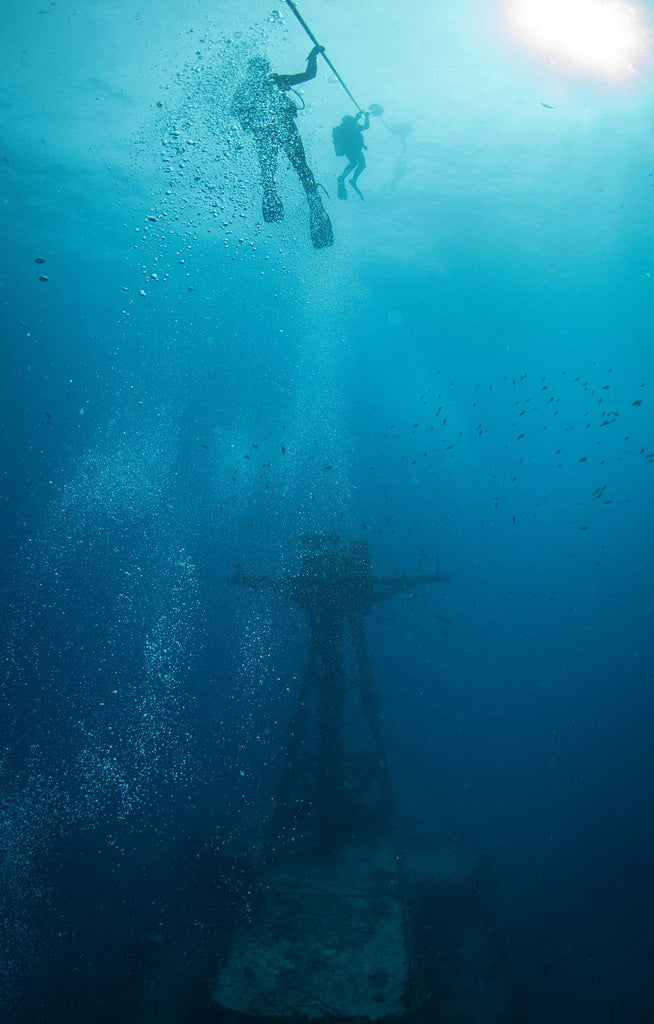 divers with wreck photo by jonathan miller 