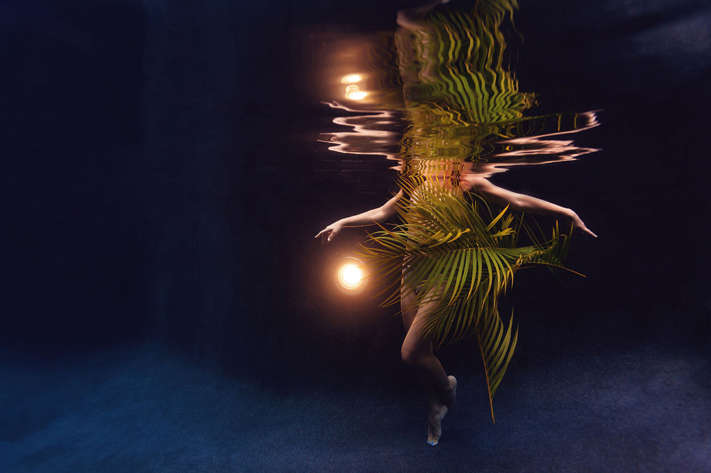 tristine davis underwater model with fern and backlight taken using ikelite underwater housing and strobes