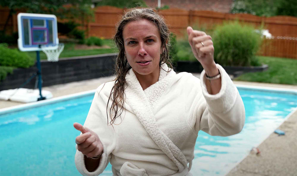 Denise wearing robe by the pool at Ikelite photoshoot