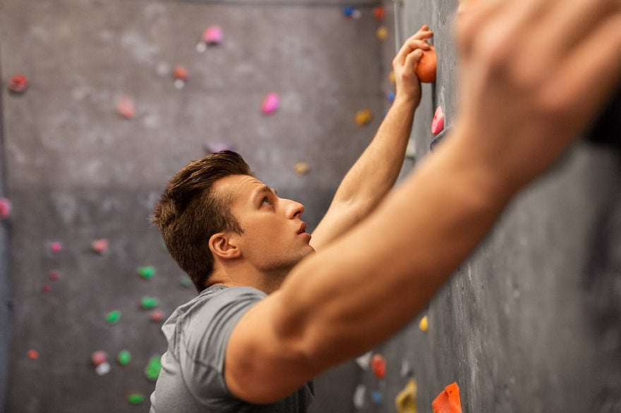 man wall climbing