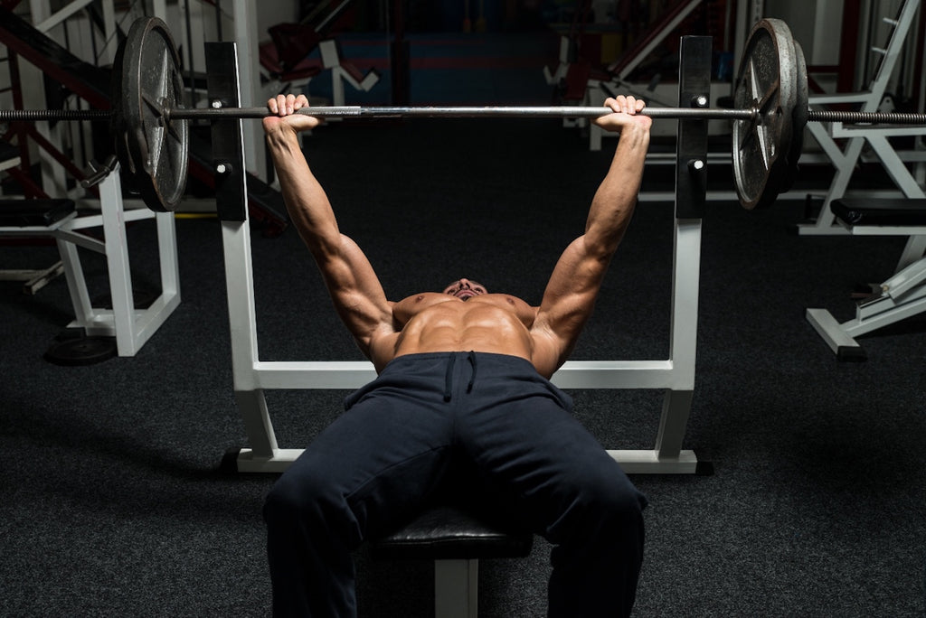 How to get stronger: Man doing barbell bench press