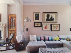 Family room with a collection of paintings on the wall