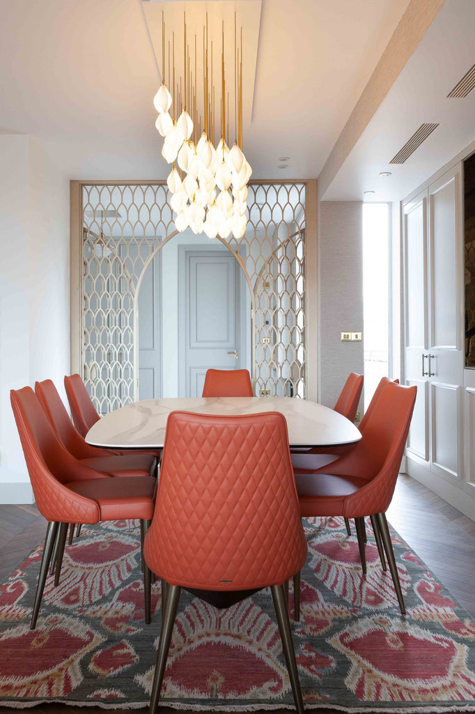 Dining area with view to hallway and lit chadelier