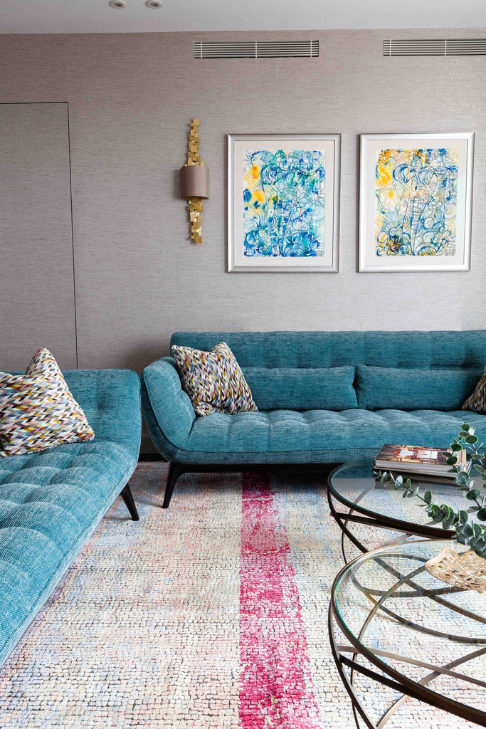 Living area with mosaic carpet and hidden door to sons's bedrooms