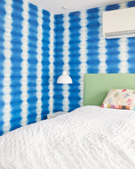 Youngest daughter's bedroom with magnetic blue wallpaper 