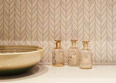 Master bathroom with a multi coloured sink on a marble top with Ann Sacks mosaics as backsplash