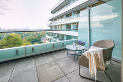 Balcony seating and view of the park