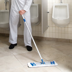 Janitor uses microfober mop to clean restroom