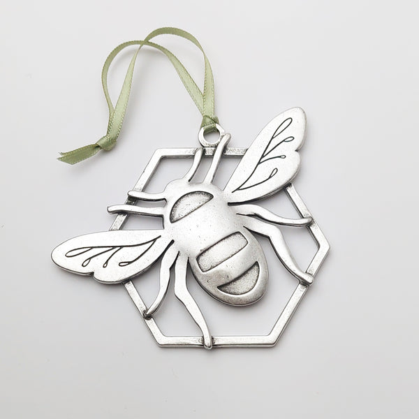 https://cdn.shopify.com/s/files/1/0867/2548/products/beehandmadepewterholidayornament_600x600.jpg?v=1664742744