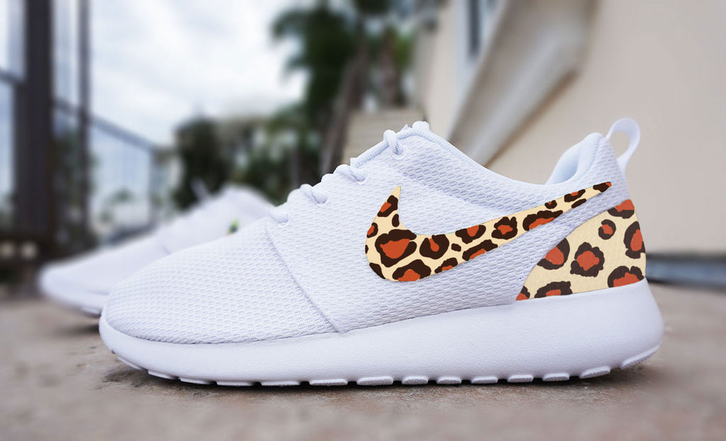 white leopard print roshe runs