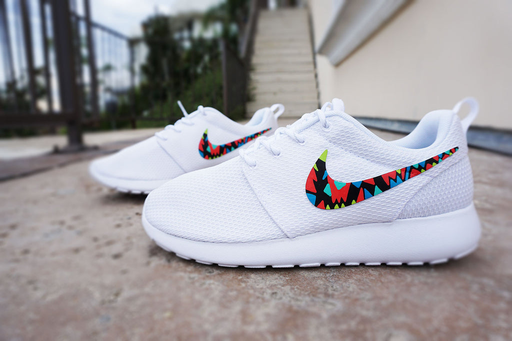 white nike shoes with rainbow swoosh