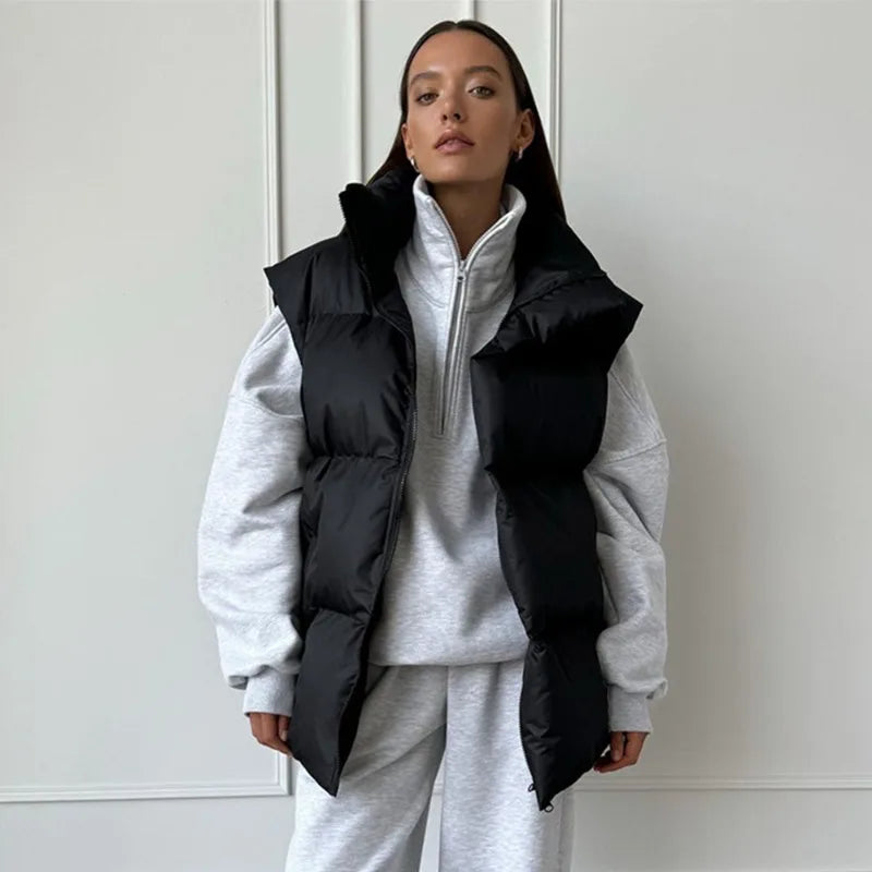 Additional view of women's puffer vest showcasing zip front and stand collar