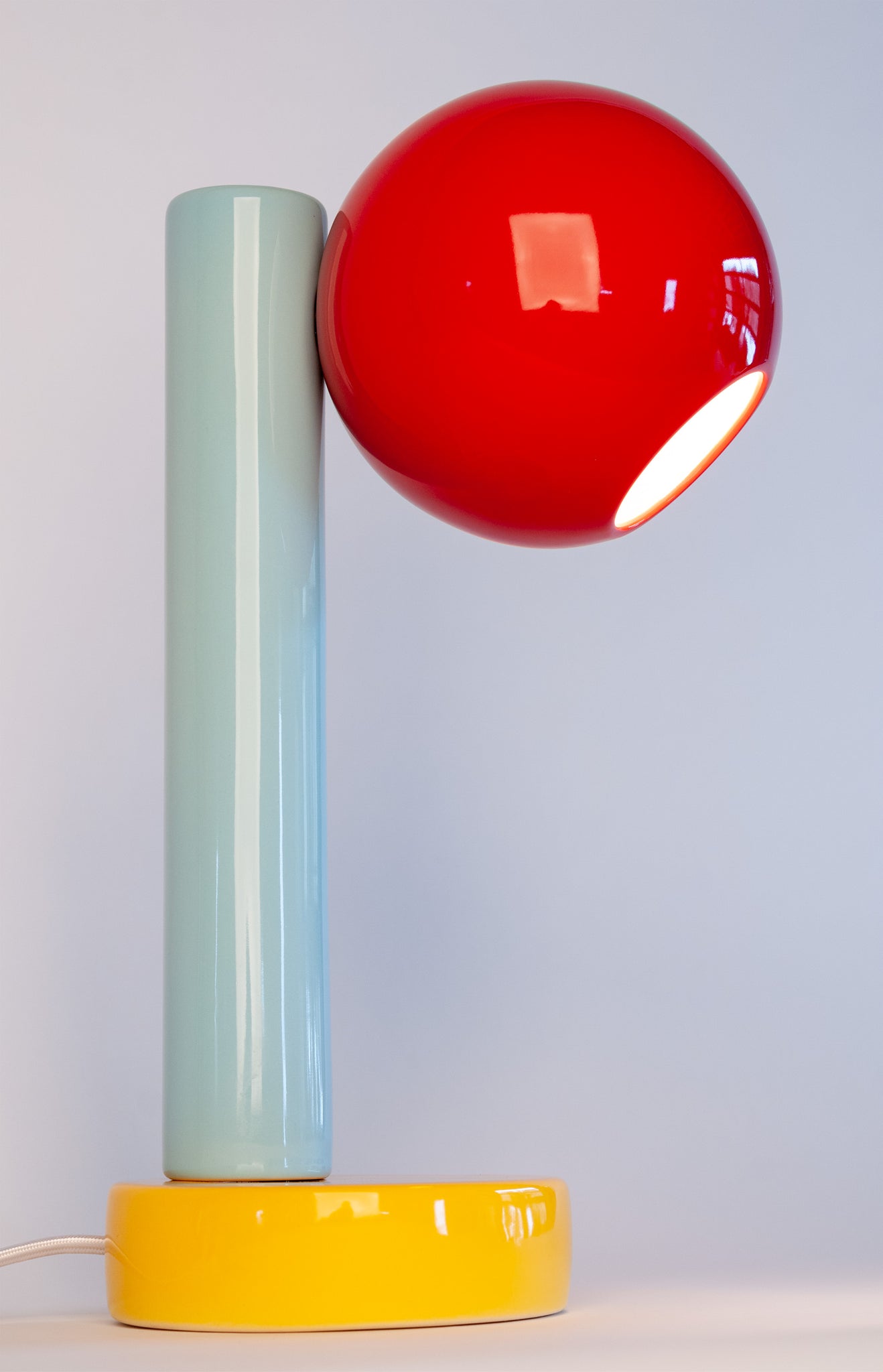 Spot On Desk Lamp in Sumac Red, Light Aqua, and Goldenrod Yellow (Side View)