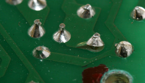 Lifted solder pad, with broken trace