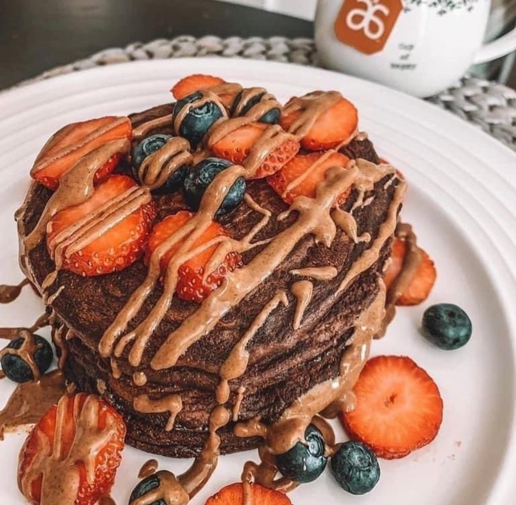 Arbonne FeelFit Protein Pancake Recipe Topped With Strawberry And Blueberries