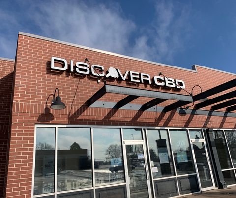 brick Discover CBD store against blue sky