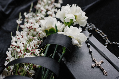 A flower bouquet on a casket