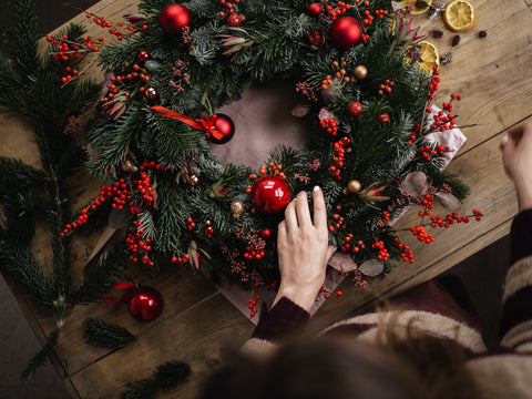 Woman creating a Christmas wreath