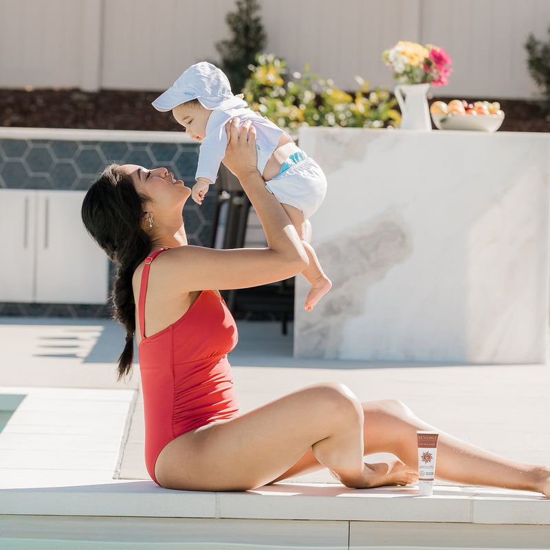 Red One Piece Swimsuit Poolside with Baby