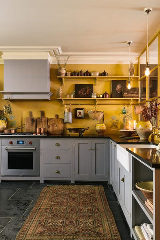 grey kitchen yellow walls wood countertop support brackets 