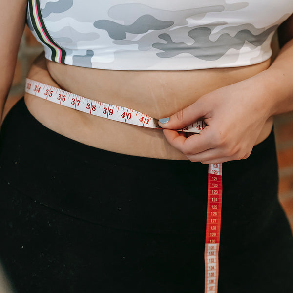Weight loss, stomach and measure tape for body measurement for