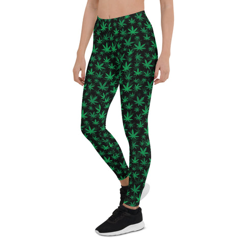 Woman wearing black and green cannabis leaf leggings