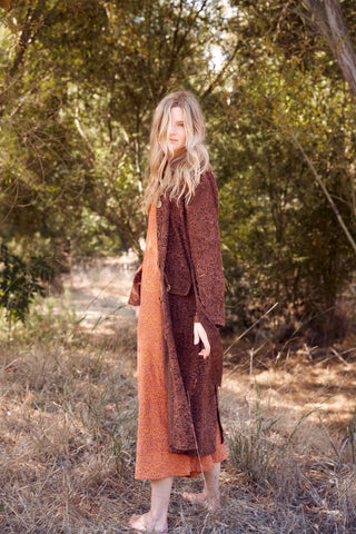 Model wearing the Carla Corduroy Coat over the Stevie Corduroy Jumpsuit in the park