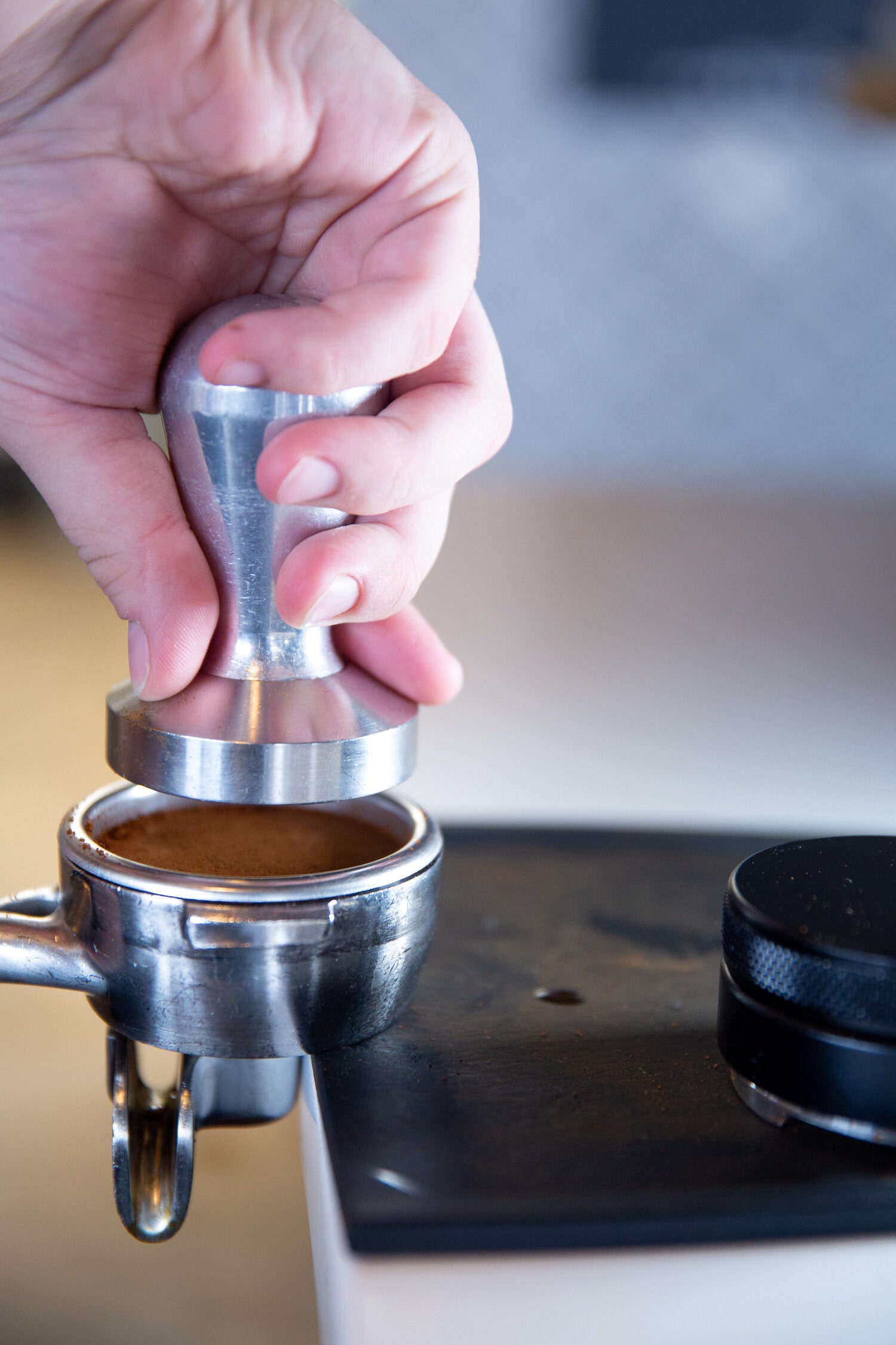 Tamping the coffee grounds