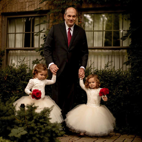 flower girls in tutu dresses with father of the bride