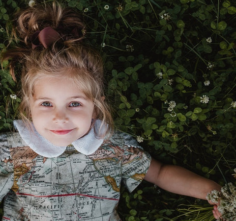 Vintage Inspired handmade back to school dress for girls. Cotton textile with world map design, white eyelet collar and wooden buttons. Couture Dressmaker NYC