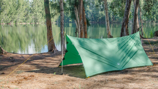 2 Pole Tarp Camping Mode of Apex Tarp using found sticks or your hiking poles, the Apex can be pitched as a camping tarp with excellent coverage.