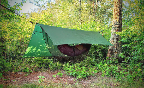 You can use any of the tie-out loops on the ends of the tarp to set it up off center to block wind. The many tie-off loops at the ends make the Apex extremely versatile.