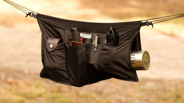 The secret pocket is great for water bottles, large flashlights, and more. The hammock holdall ridgeline organizer is great for hammock camping