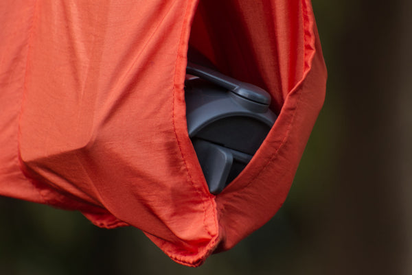 The bottom portion of the openings for the secret  pocket on  the  Hammock Holdall Ridgeline Organizer are sewn together, to prevent your gear from sliding out.